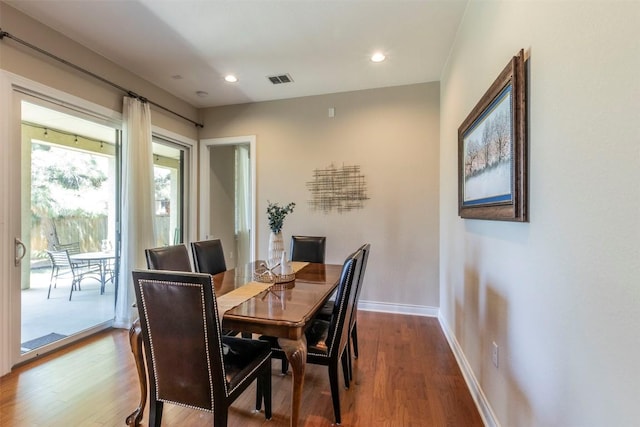 dining area featuring recessed lighting, wood finished floors, visible vents, and baseboards