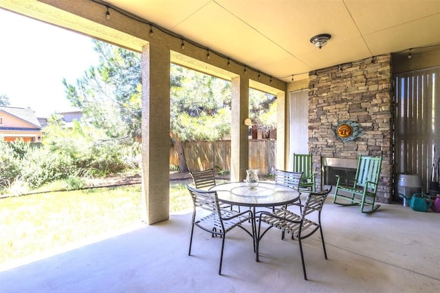 view of patio with fence and outdoor dining area