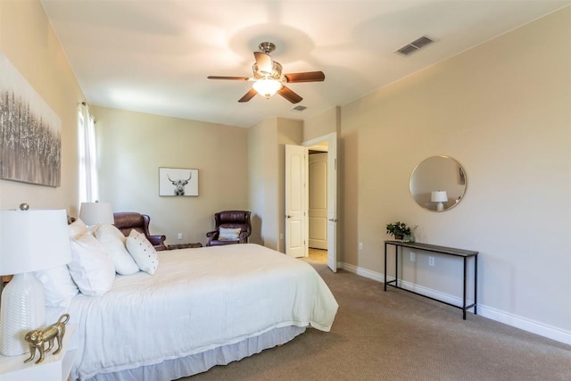 carpeted bedroom with ceiling fan, visible vents, and baseboards