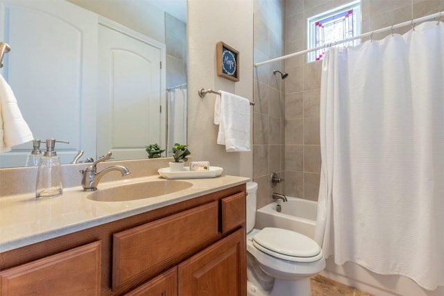 full bathroom with vanity, toilet, and shower / tub combo with curtain