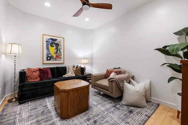 living room with recessed lighting, ceiling fan, baseboards, and wood finished floors