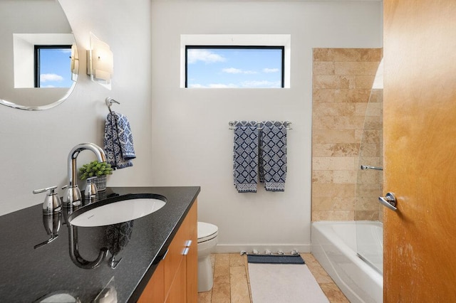 full bath featuring a healthy amount of sunlight, baseboards, toilet, and tile patterned floors