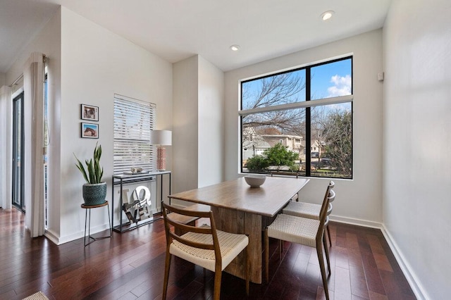 dining area featuring dark wood-style floors, baseboards, and recessed lighting