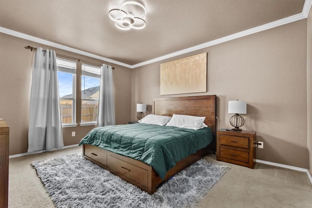 bedroom featuring ornamental molding, carpet, a textured ceiling, and baseboards