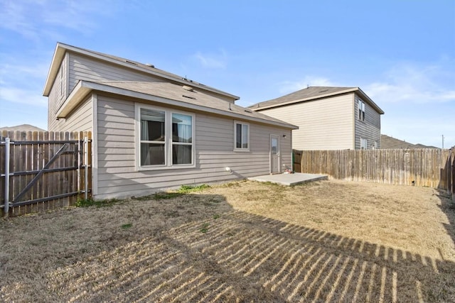 back of property featuring a patio area and a fenced backyard