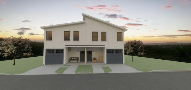 view of front of property with a garage and driveway