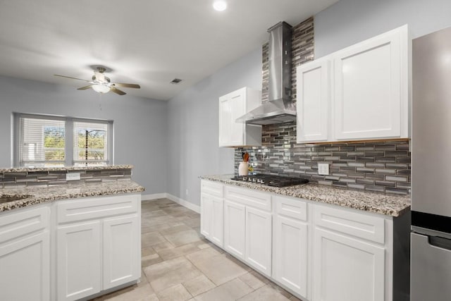 3660 Stagecoach Ranch Loop, Dripping Springs, TX 78620 - kitchen featuring wall chimney exhaust hood, tasteful backsplash, a ceiling fan, stainless steel appliances, and baseboards
