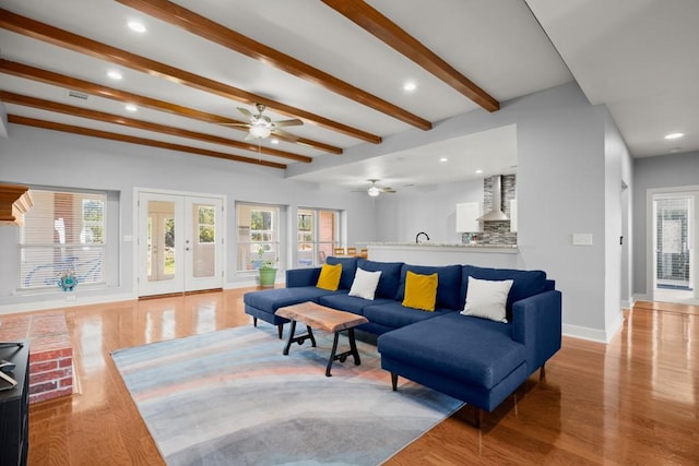 3660 Stagecoach Ranch Loop, Dripping Springs, TX 78620 - living room with plenty of natural light, baseboards, a ceiling fan, and wood finished floors