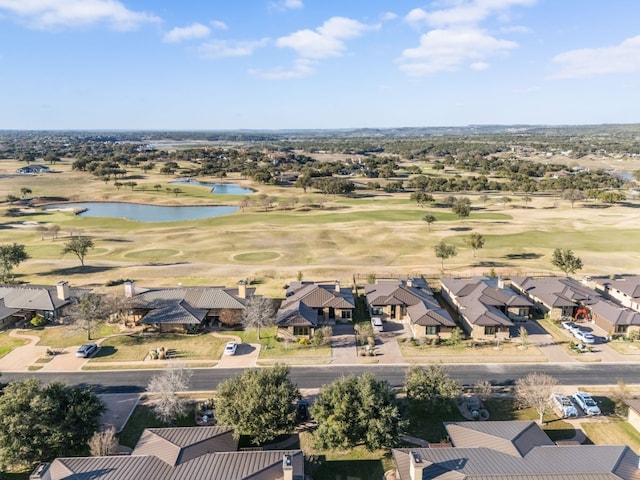 aerial view featuring a water view, a residential view, and golf course view