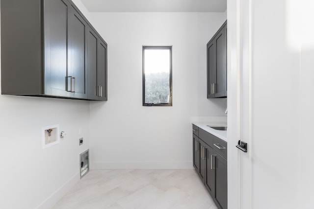 laundry area with baseboards, washer hookup, cabinet space, and hookup for an electric dryer