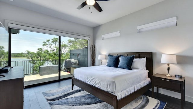 bedroom with access to outside, a ceiling fan, and wood finished floors