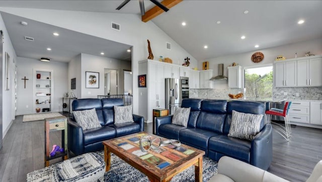 living room featuring high vaulted ceiling, beam ceiling, wood finished floors, and visible vents