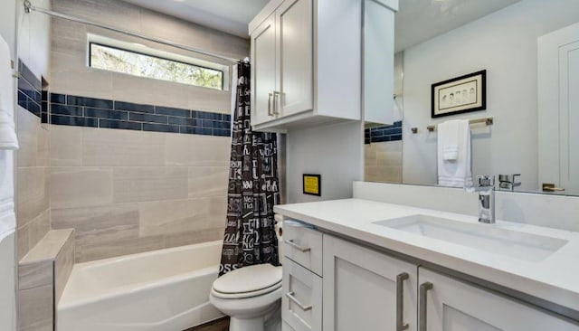 full bath featuring vanity, toilet, and shower / bath combo with shower curtain