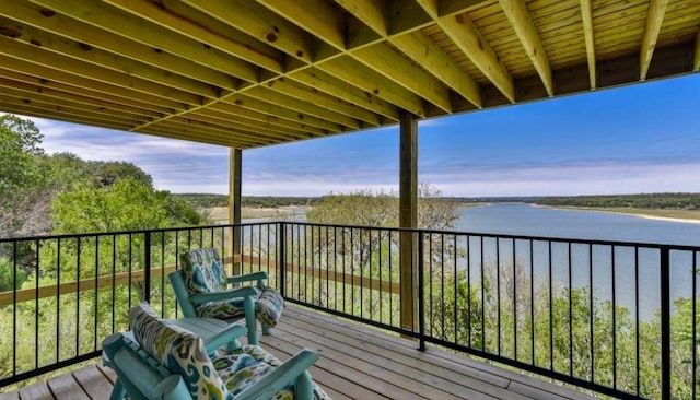 wooden deck with a water view