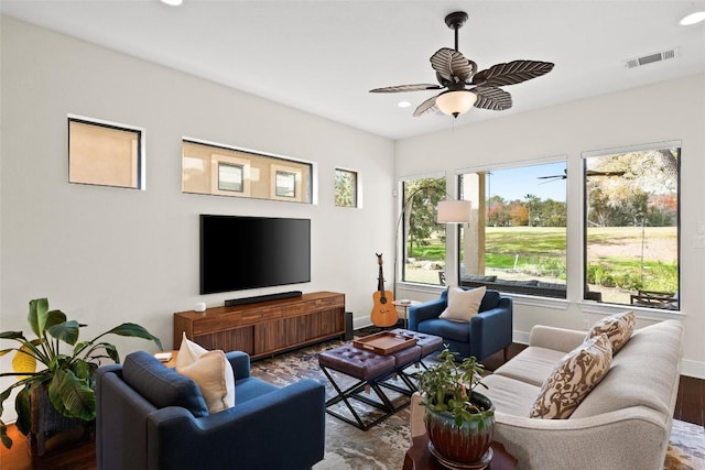 living area with visible vents, wood finished floors, baseboards, recessed lighting, and a ceiling fan
