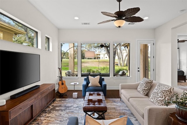 living room featuring ceiling fan, visible vents, wood finished floors, and recessed lighting