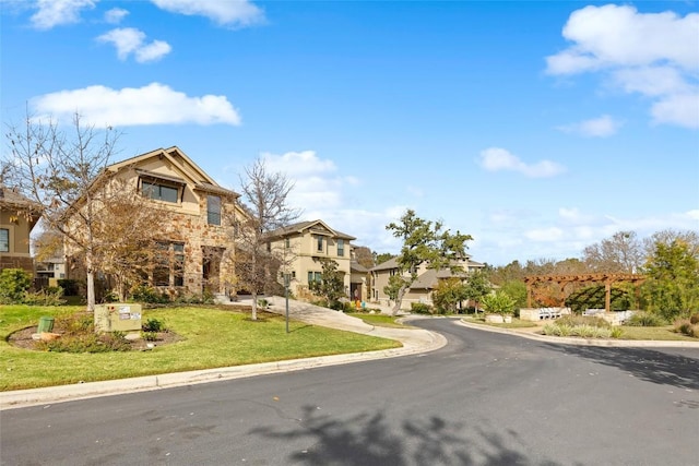 view of front of home featuring stone siding, a front lawn, and a residential view