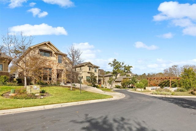view of front of home with a front lawn, stone siding, stucco siding, driveway, and a residential view