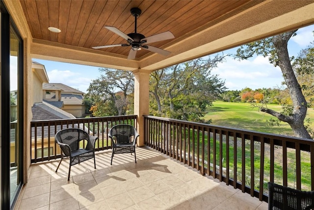 balcony featuring ceiling fan and golf course view