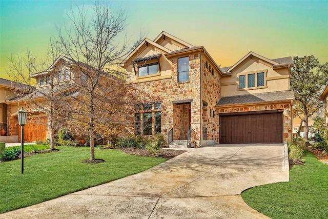 craftsman inspired home featuring driveway, a garage, stone siding, a front lawn, and stucco siding