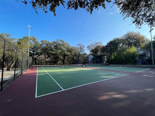 view of sport court featuring community basketball court and fence