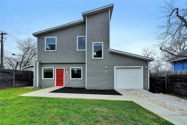 back of property featuring a lawn and fence