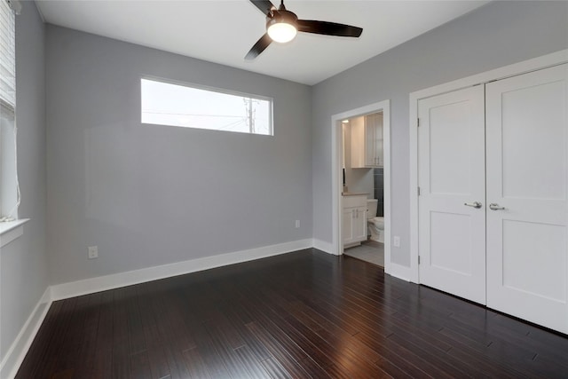 6902 Carver Ave Unit B, Austin, TX 78752 - unfurnished bedroom featuring a closet, dark wood-type flooring, baseboards, and ensuite bathroom