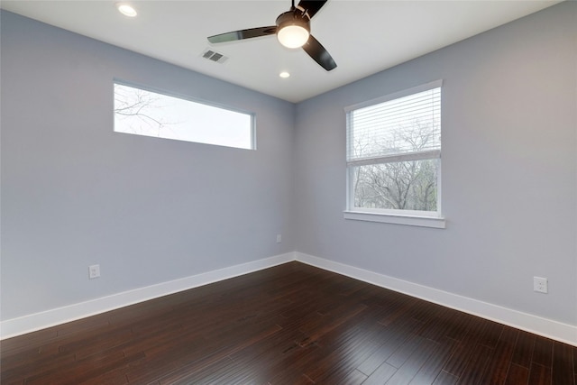 6902 Carver Ave Unit B, Austin, TX 78752 - unfurnished room featuring healthy amount of natural light, baseboards, ceiling fan, dark wood-style floors, and recessed lighting