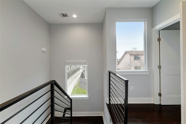 6902 Carver Ave Unit B, Austin, TX 78752 - stairs featuring baseboards, wood finished floors, and recessed lighting