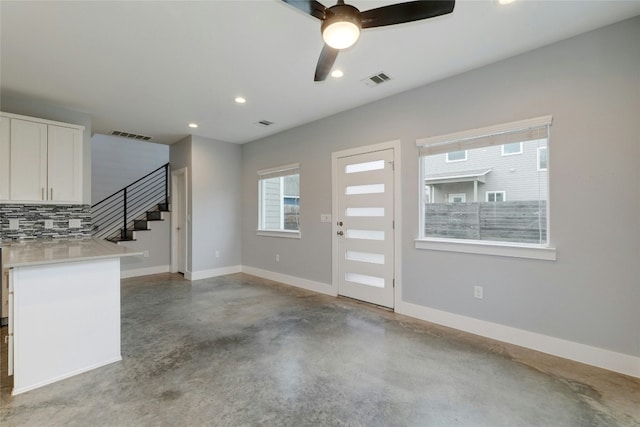 6902 Carver Ave Unit B, Austin, TX 78752 - foyer entrance with finished concrete floors, stairs, a ceiling fan, and recessed lighting