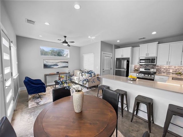 6902 Carver Ave Unit B, Austin, TX 78752 - dining space featuring recessed lighting, a ceiling fan, finished concrete floors, and baseboards