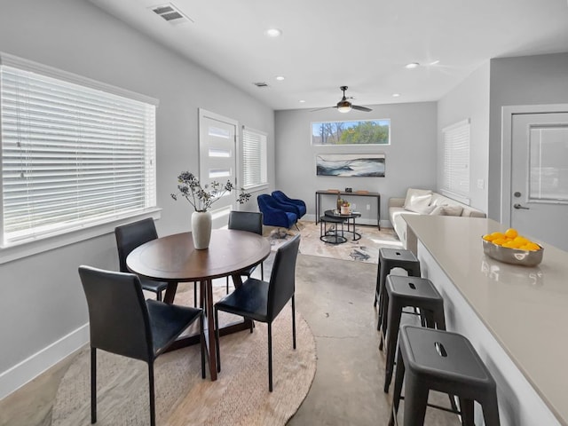 6902 Carver Ave Unit B, Austin, TX 78752 - dining room featuring unfinished concrete floors, ceiling fan, baseboards, and recessed lighting