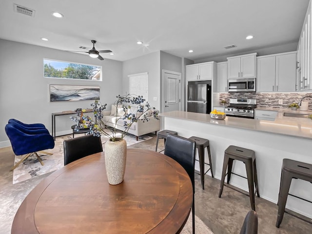 6902 Carver Ave Unit B, Austin, TX 78752 - dining area featuring a ceiling fan, recessed lighting, and baseboards