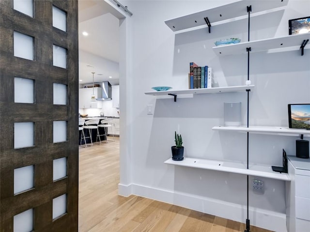 office featuring recessed lighting, light wood-style flooring, and baseboards