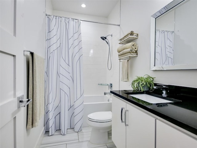 bathroom featuring shower / bathtub combination with curtain, vanity, and toilet