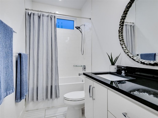 full bathroom featuring shower / bath combination with curtain, vanity, and toilet