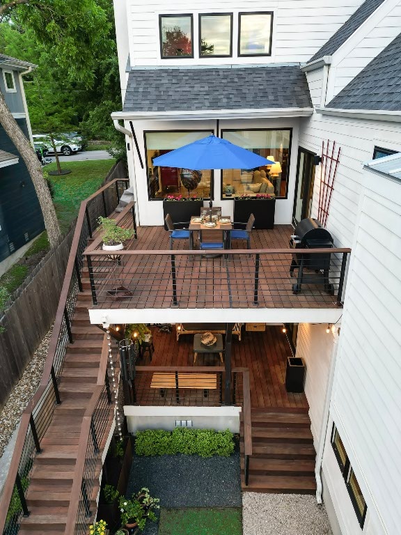 wooden terrace featuring stairway and grilling area