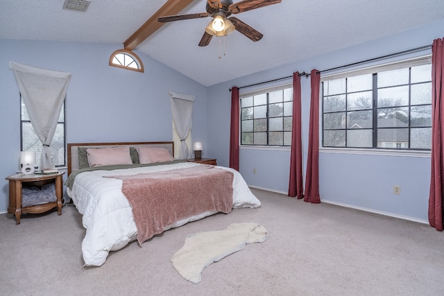 carpeted bedroom with vaulted ceiling with beams, a textured ceiling, a ceiling fan, visible vents, and baseboards