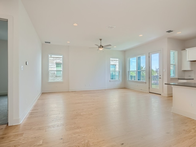 unfurnished living room featuring visible vents, baseboards, light wood-style flooring, ceiling fan, and recessed lighting