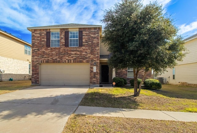 traditional-style house featuring concrete driveway, brick siding, and a front lawn