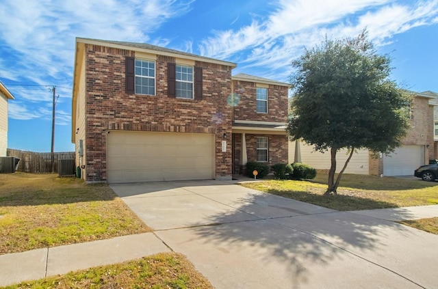 traditional home featuring driveway, an attached garage, fence, a front lawn, and brick siding