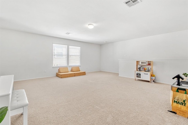 playroom featuring carpet, visible vents, and baseboards