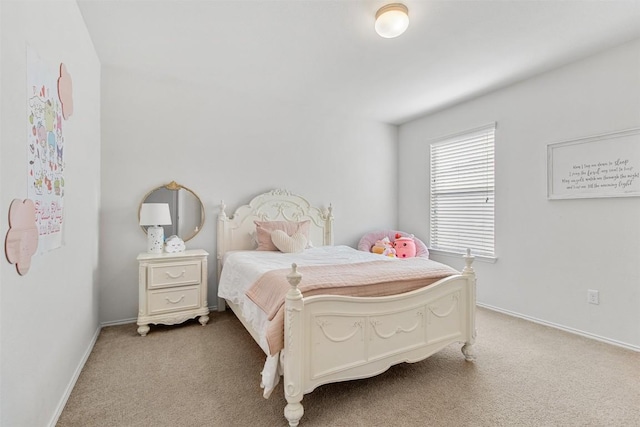 bedroom featuring carpet floors and baseboards