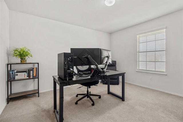 home office with baseboards and carpet flooring