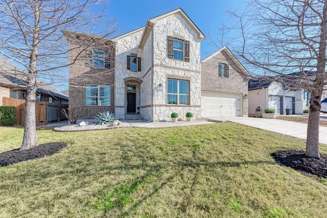 view of front of house with stone siding, fence, concrete driveway, and a front yard