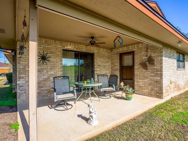 view of patio featuring ceiling fan