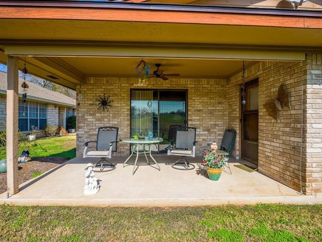 view of patio featuring ceiling fan