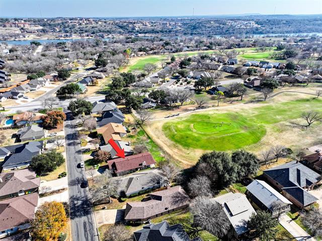 aerial view with view of golf course and a residential view