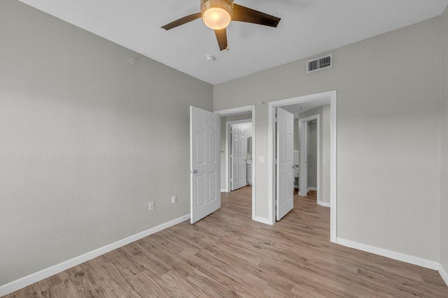 unfurnished bedroom featuring light wood-type flooring, visible vents, and baseboards