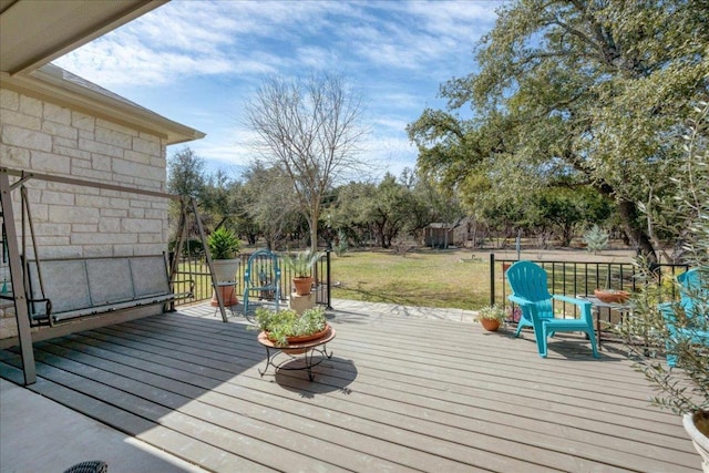 deck featuring a lawn